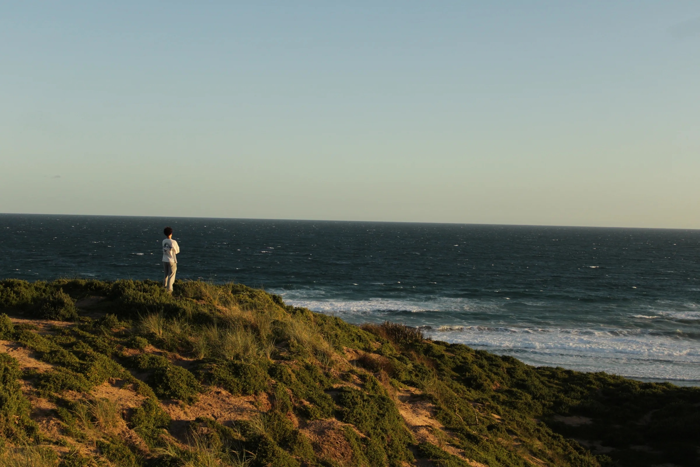 My mate (Rhys), looking out over the cliffs of Phillip Island.